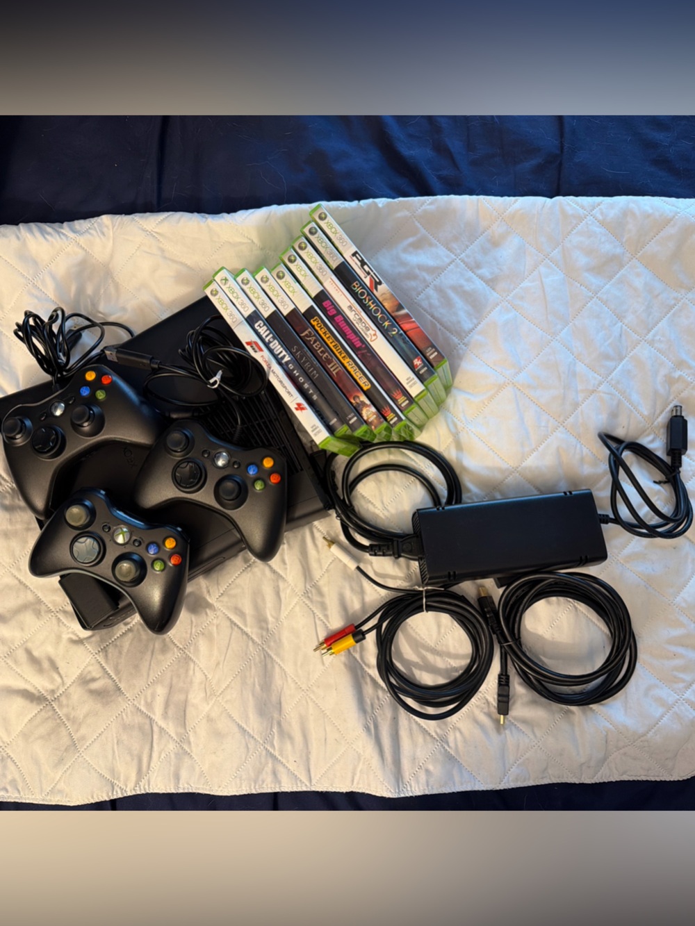 Microsoft Xbox 360 Slim Bundle - Console, 3 Controllers, Battery Pack & 9 Games